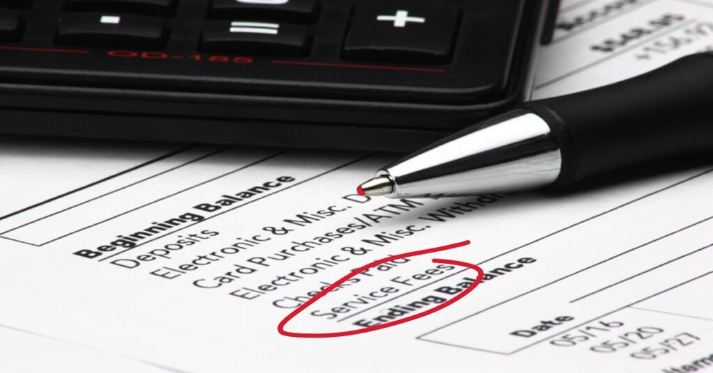Checking service fees on a bank statement.