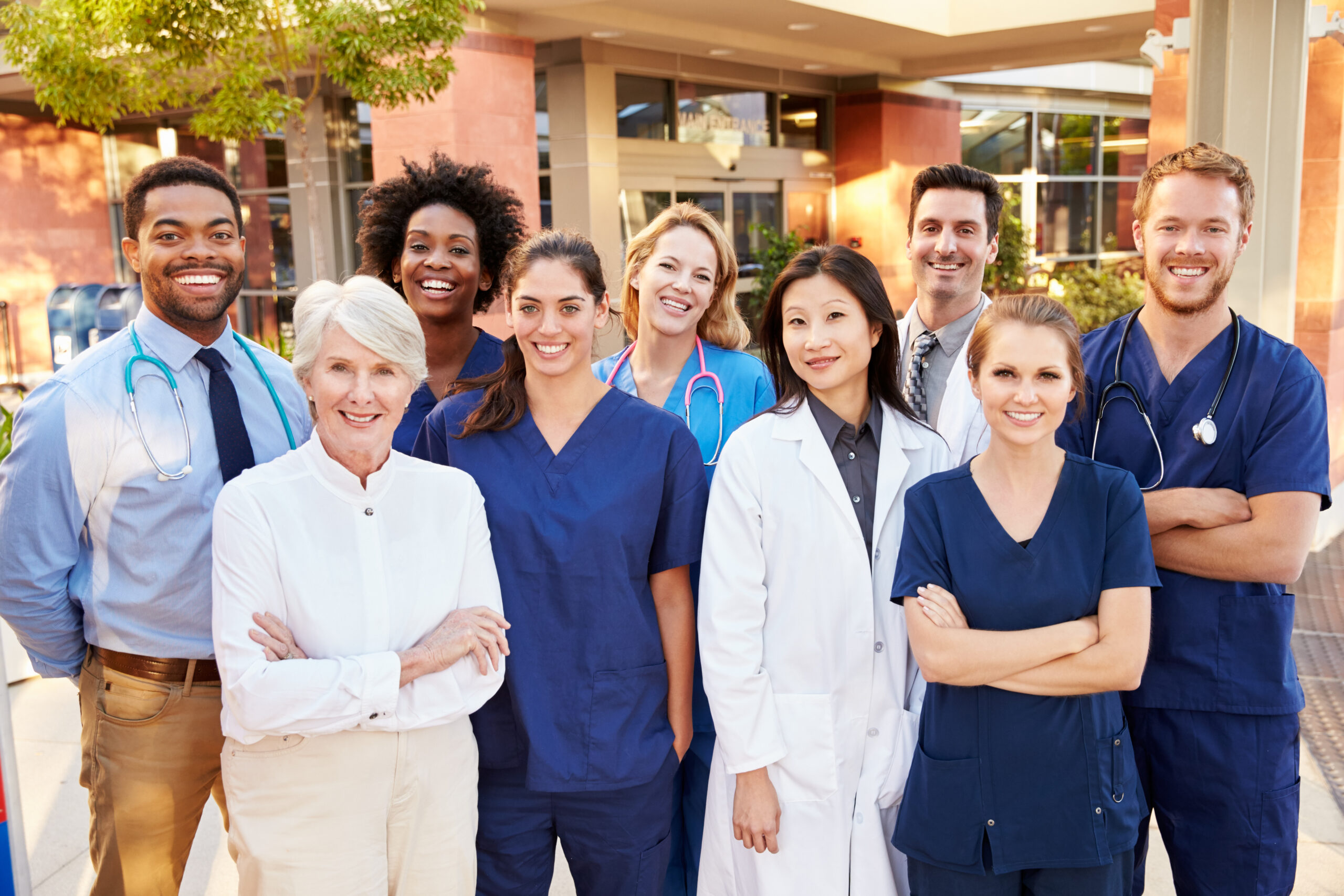 Medical team standing outside of a hospital
