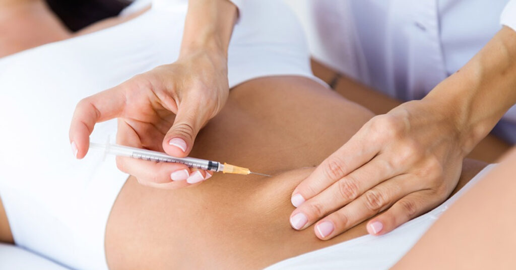 Woman getting weight loss drug injected into her stomach