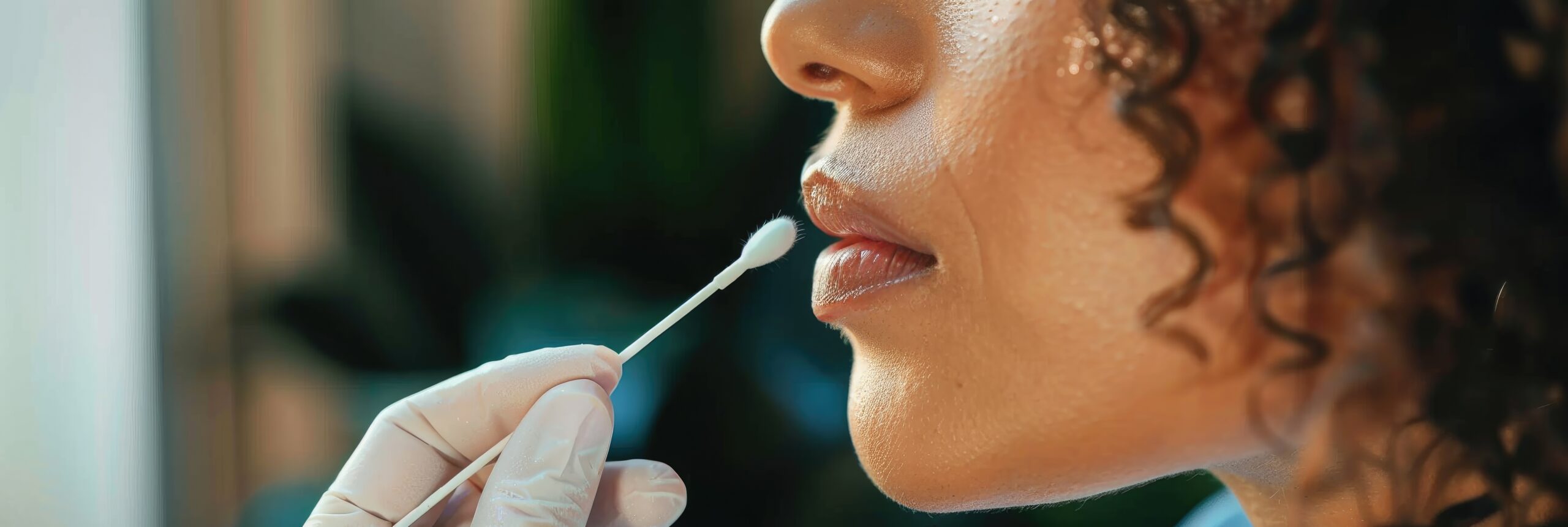 Woman performing a DNA test at home using a cotton swab