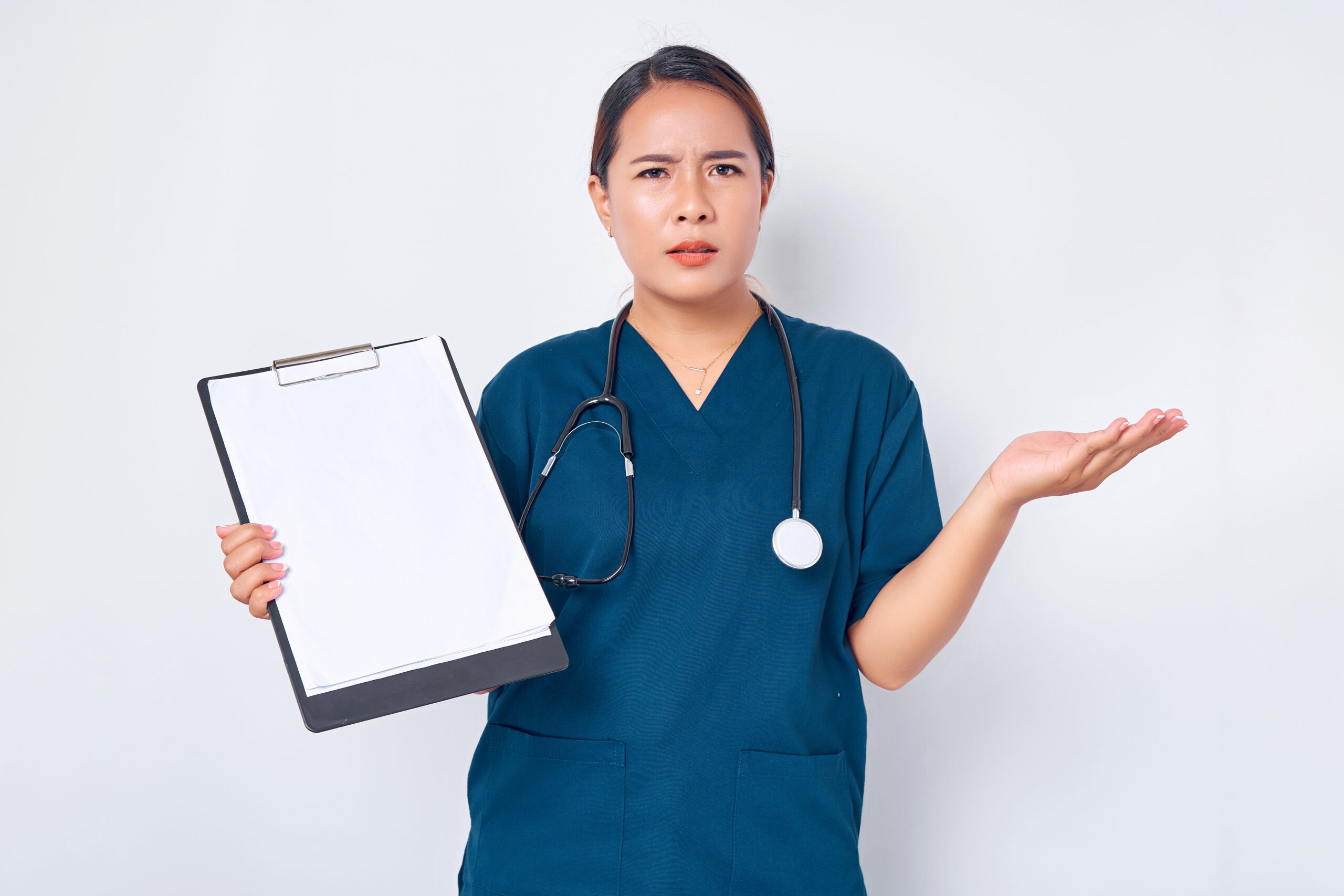 Doctor shrugging confusedly while holding a clipboard