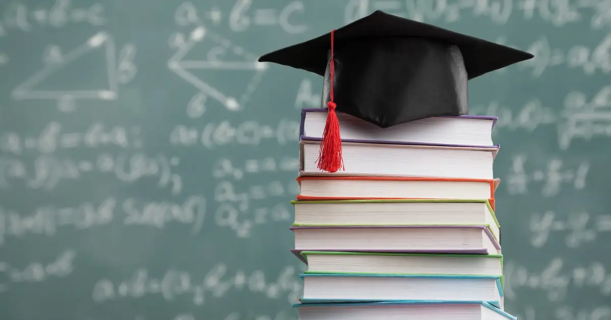 image of a blackboard and stack of books