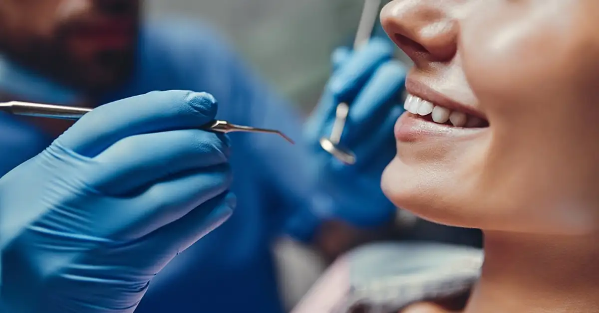 image of a dentist working on a female patient