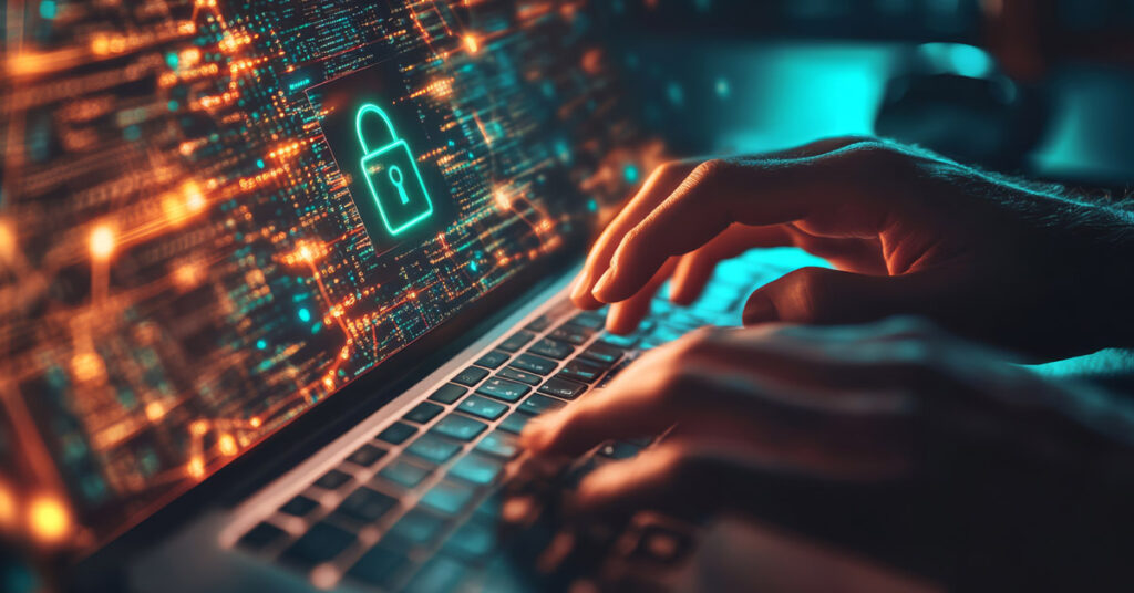 onset image of hands on a laptop keyboard trying to hack into it